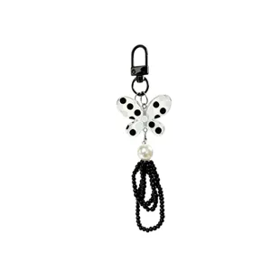 Elegant black and white butterfly beaded keychain with pearl accent for bags and phones
