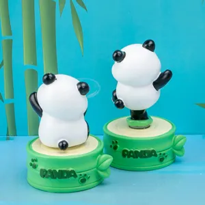 Detailed view of cute panda resin blind box figurines on green bamboo-themed bases for home decor.