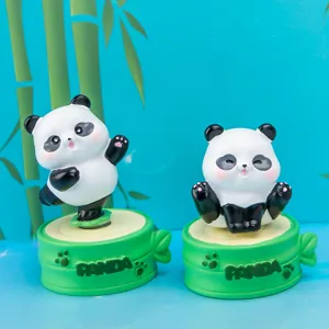 Detailed view of cute resin panda blind box figurines on bamboo-shaped bases.