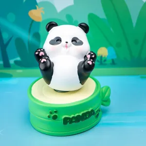Detailed view of cute panda resin figurine on a rotating green bamboo base