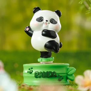 Adorable cartoon panda resin figurine performing a dynamic pose for home desktop decor