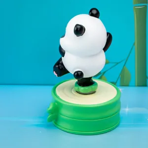 Close-up detailed view of a cute panda resin figurine on a green bamboo-style base