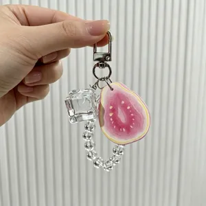 Detailed view of a creative guava fruit keychain with ice cube charm and clear beads