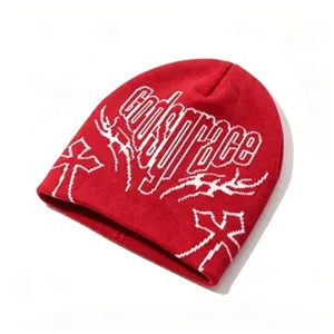 Detailed view of red hip-hop beanie with white Gods Grace jacquard patterns