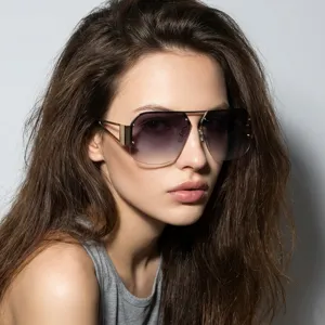 Close-up of model wearing rimless square metal sunglasses with gradient lenses