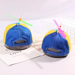 Detail of children's propeller hat featuring adjustable strap and colorful design