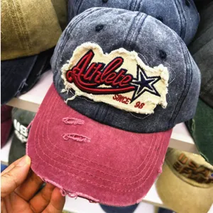 Detailaufnahme einer Vintage-Baseballkappe mit Athlete-Stickerei und Sternenlogo