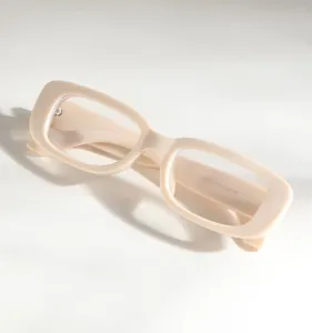 Detailed view of vintage beige small square frame glasses with model numbers on temple