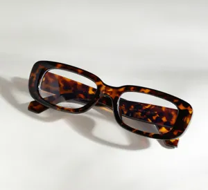 Detailed macro view of retro tortoiseshell square frame glasses with leopard print