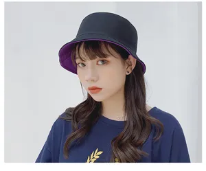 Asian female model wearing a stylish double-sided black and purple cotton bucket sun hat.