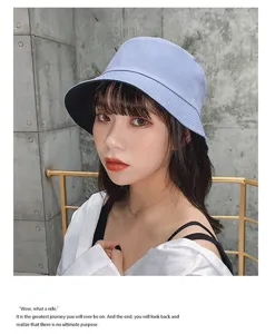 Detail of a reversible blue cotton bucket hat for women featuring wide brim protection