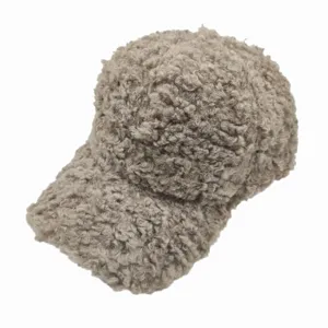Close-up view of fuzzy lamb wool baseball cap in brownish-grey color showing thick texture.