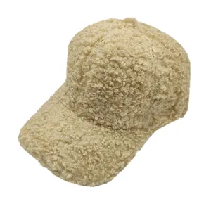 Detail view of the soft beige faux lambswool texture on this warm winter baseball cap.