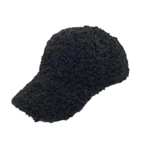 Close-up of black fuzzy sherpa baseball cap for women showing warm fleece texture.
