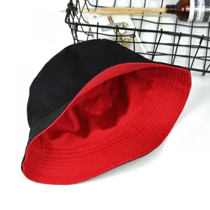 High-quality reversible cotton bucket hat in black and red for sun protection and style