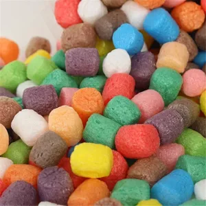 Macro detail of colorful biodegradable magic corn foam blocks for kids' DIY crafts.