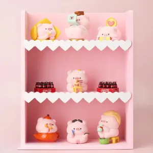 Adorable collection of pink pig figurines on a pink heart-shaped display shelf