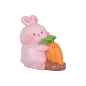 Adorable pink rabbit figurine holding a large carrot cartoon blind box collectible