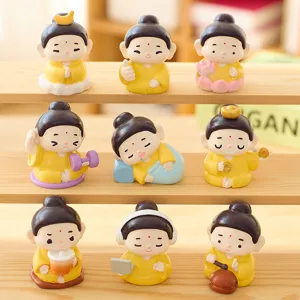 Set di nove graziose figurine di Buddha in resina per decorazioni da casa e ufficio