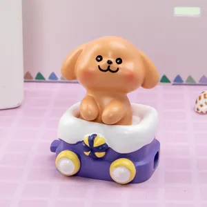 Close-up of a cute resin puppy figurine inside a purple toy train car ornament