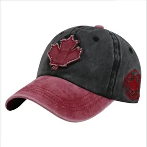 Close-up of washed distressed baseball cap with embroidered red maple leaf patch
