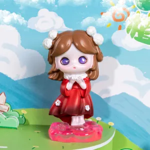 Détail d'une figurine de fille de style chinois en robe rouge, jouet blind box