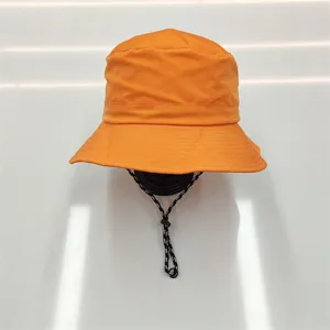 Front detail of vibrant orange quick-dry bucket hat with adjustable chin strap