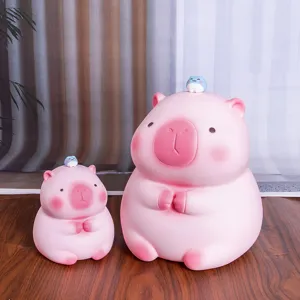 Dos adorables huchas de carpincho rosa en diferentes tamaños