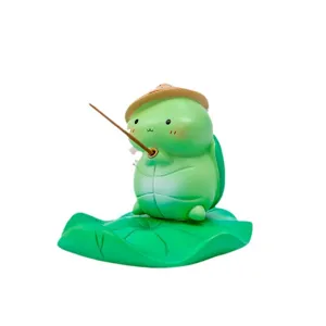Cute green turtle phone holder desktop ornament with fishing rod and lotus leaf base