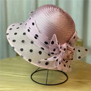 Elegant pink sun hat for women with organza polka dots and floral bow decoration
