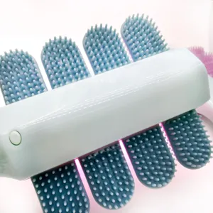 Pet massage brush with light sterilization, blue silicone fingers and white handle detail view.