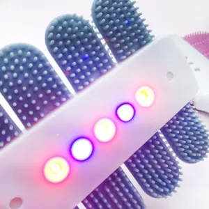 LED pet brush detail showing soft silicone bristles and glowing light beads for grooming.