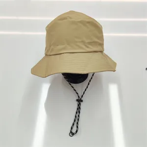 Close-up of quick-dry waterproof bucket hat with adjustable chin strap for hiking
