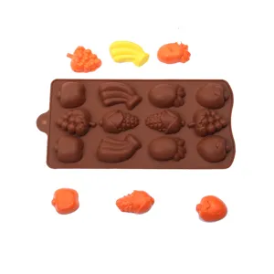 Silicone baking mold detail showing flexible brown tray and various fruit shapes for chocolate DIY.