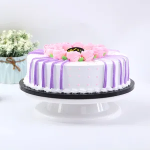 Detailed view of white plastic cake turntable with smooth rotating base for DIY baking.