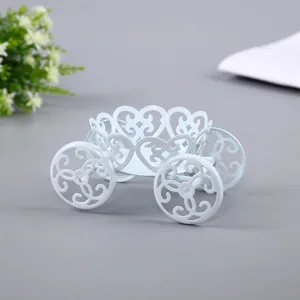 Detailed view of light blue iron carriage sweet dessert holder with heart hollow design.