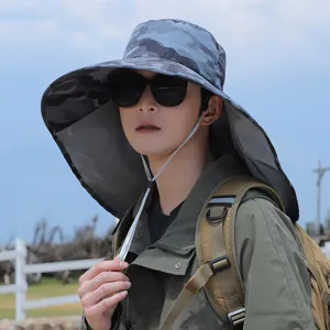 Side view of man wearing a camouflage sun hat with protective neck flap outdoors