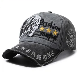 Detailed view of distressed cotton baseball cap with Indian embroidery and patches.