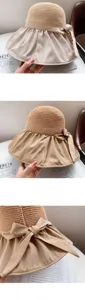 Detailed views of a women's straw sun hat featuring a wide fabric brim and elegant bow