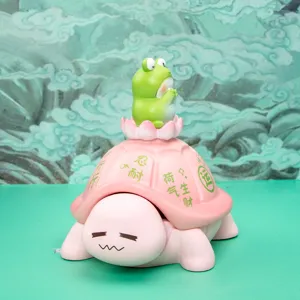 Detail of a pink turtle storage ornament with a frog sitting on a lotus