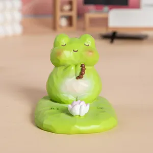 Figurine de grenouille zen mignonne sur base de feuille de lotus pour décor bureau