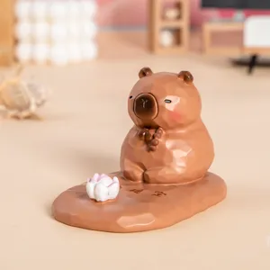 Figurine de capybara mignonne support de téléphone avec socle de fleur de lotus