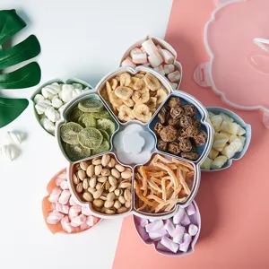 Scatola per snack in plastica a forma di fiore con scomparti multipli e coperchio.