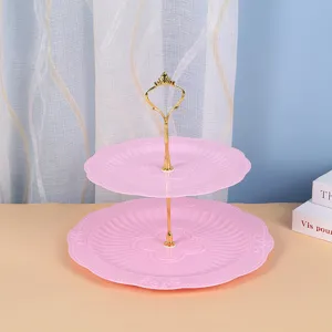 Detail view of the 2-tier pink plastic dessert tray with gold handle for afternoon tea display.