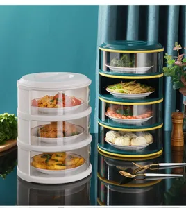 Lifestyle view of multi-layer transparent food covers holding various dishes on a table