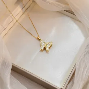 Elegant gold butterfly pendant necklace with sparkling zircon stones in a gift box