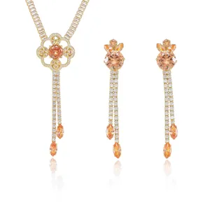 Parure élégante en zircon orange avec collier à pompons et boucles d'oreilles pendantes