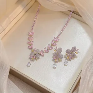 Elegant pink and yellow cubic zirconia floral necklace and earring jewelry set detail