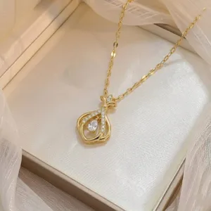 Close-up of gold-plated titanium steel necklace with teardrop zircon pendant