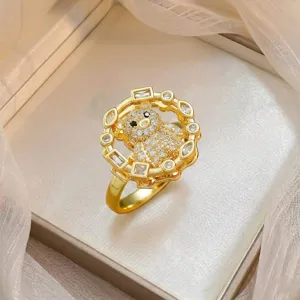 Detail view of a gold plated bear ring micro-set with sparkling cubic zirconia stones